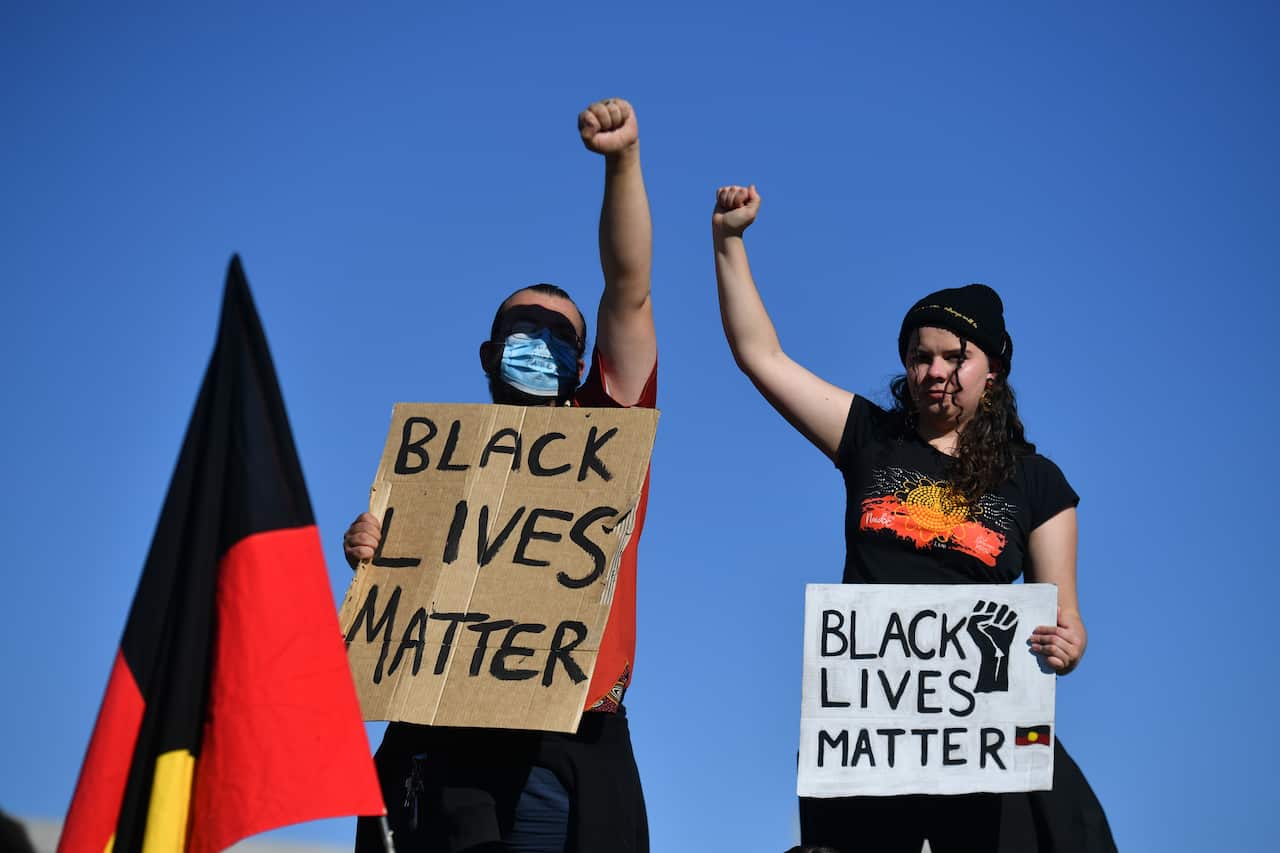 Black Lives Matter protesters in front of Parliament House in Canberra.
