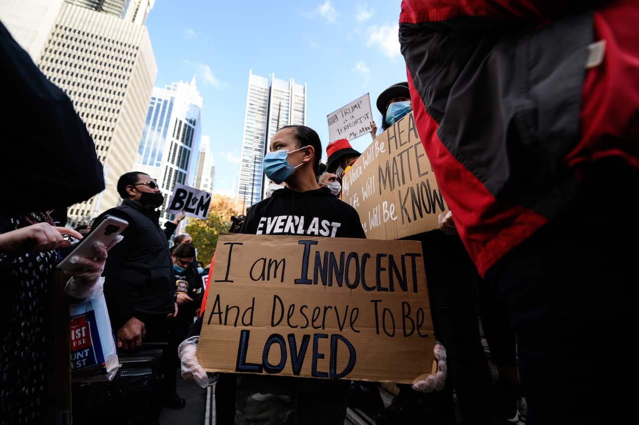 Protester stands for a racial equality at Sydney rally.
