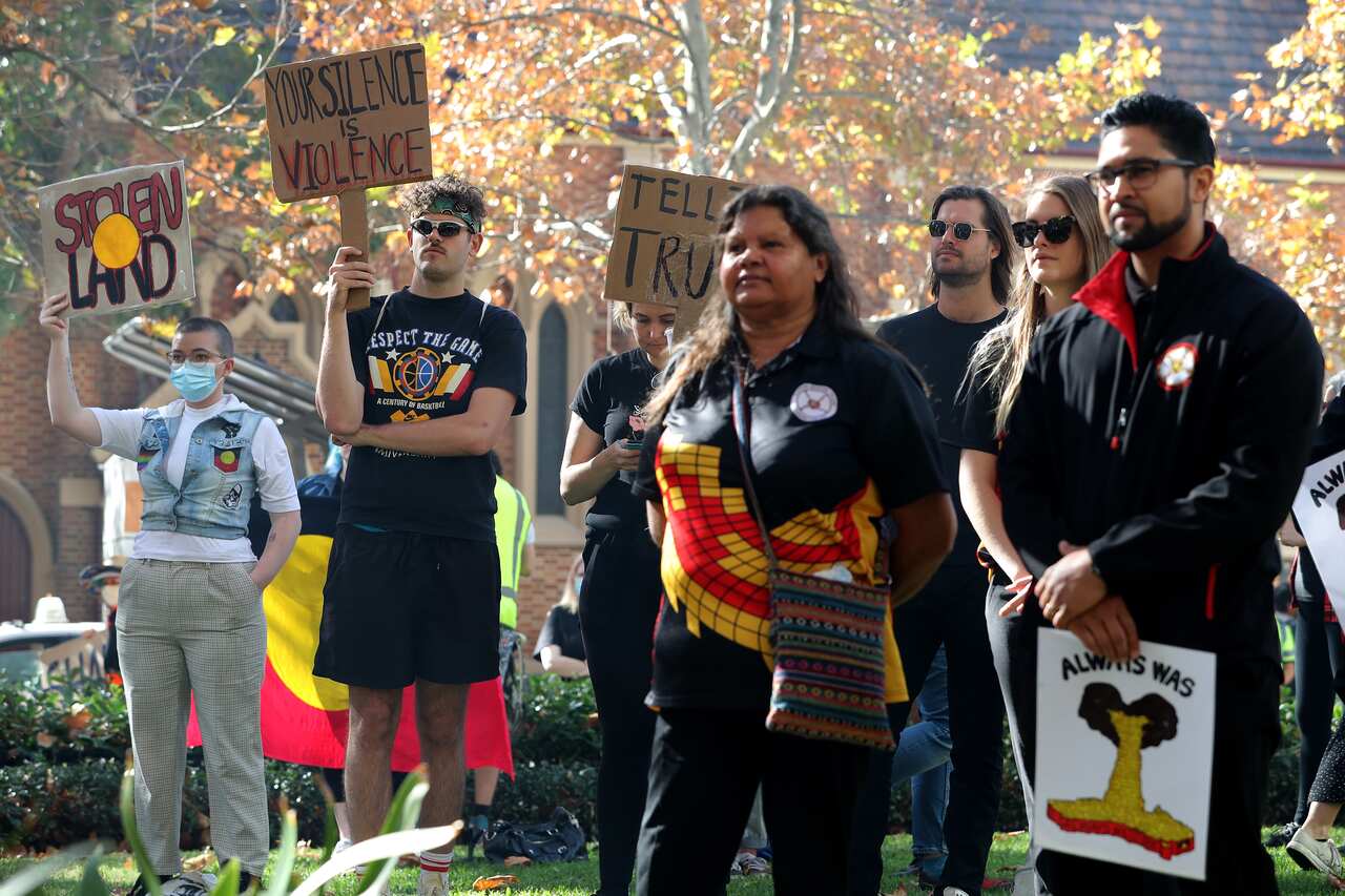 Protesters are seen during a rally outside the Rio Tinto office in Perth on 9 June 2020. The mining giant had destroyed an ancient Aboriginal cultural site.