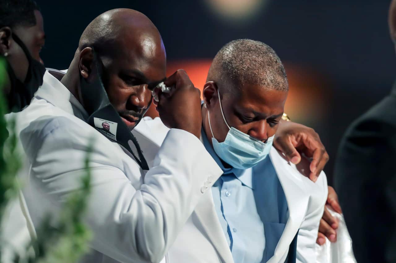 Philonise Floyd, left, puts his arm around his sister LaTonya Floyd as the family speaks during the funeral for George Floyd on Tuesday, June 9, 2020, at The Fountain of Praise church in Houston. (Godofredo A. Vásquez/Houston Chronicle via AP, Pool)