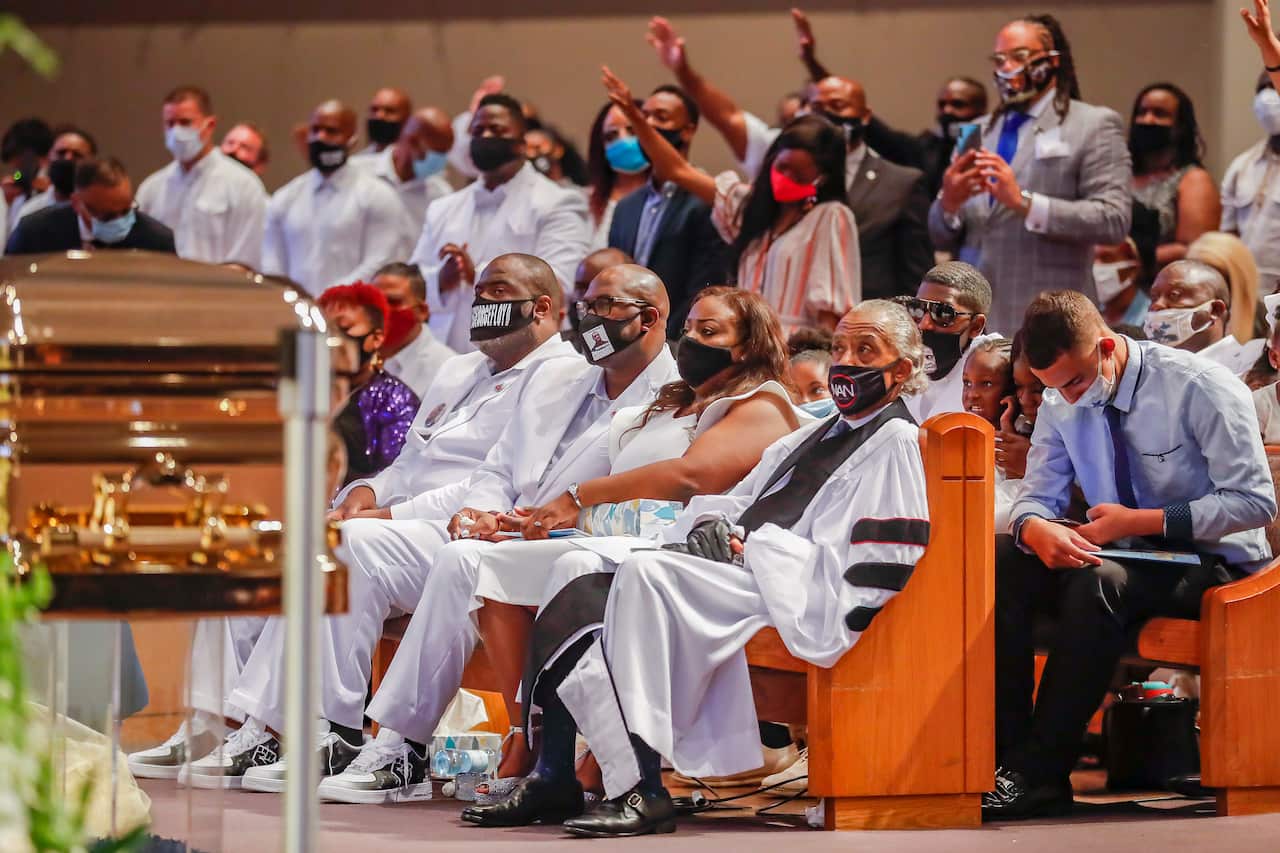 The family of George Floyd listens to Nakitta Foxx singing 'We Offer Praise' during the funeral for George Floyd.