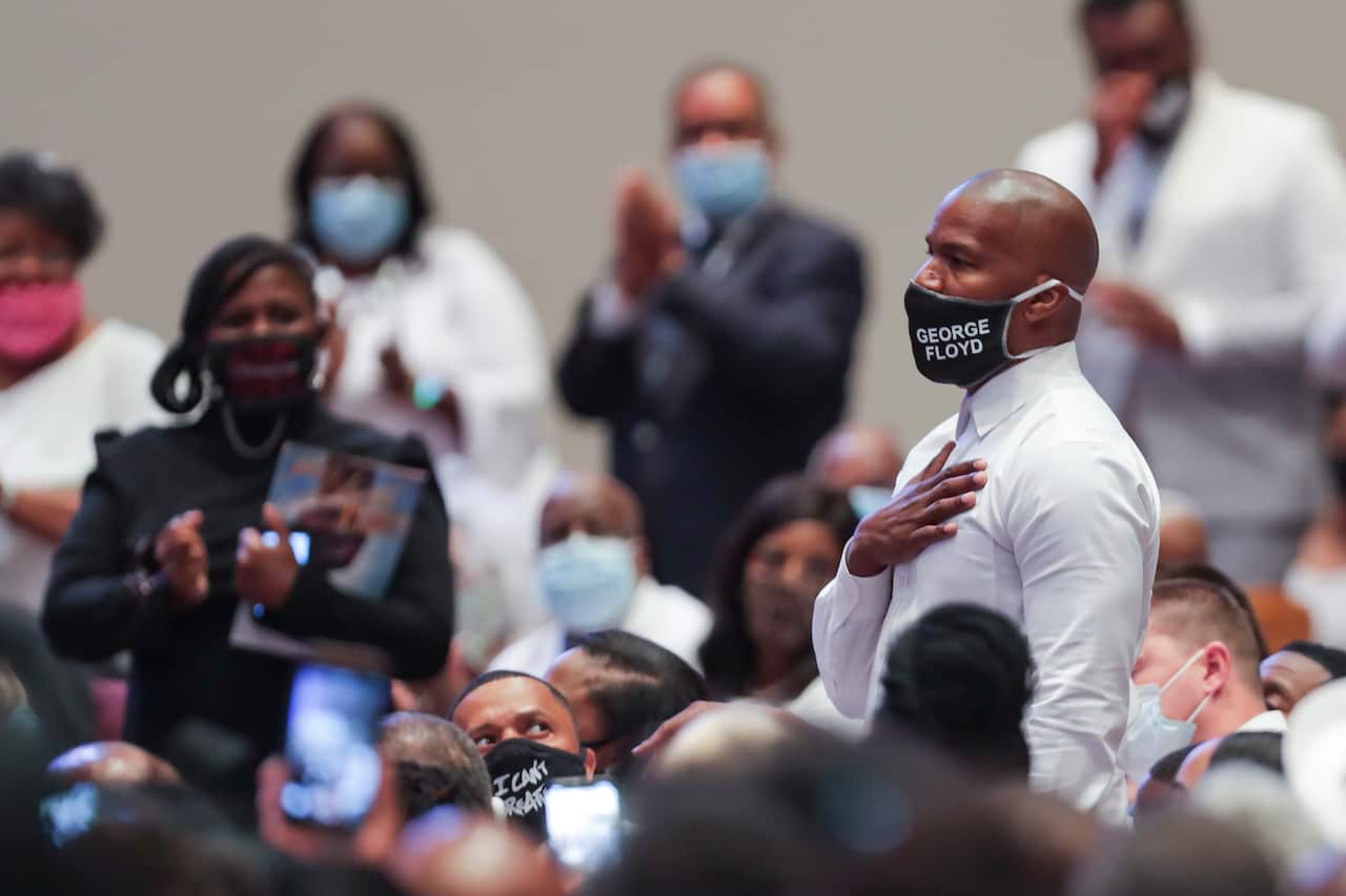 Actor Jamie Foxx is recognized by the Reverend Al Sharpton during the funeral for George Floyd