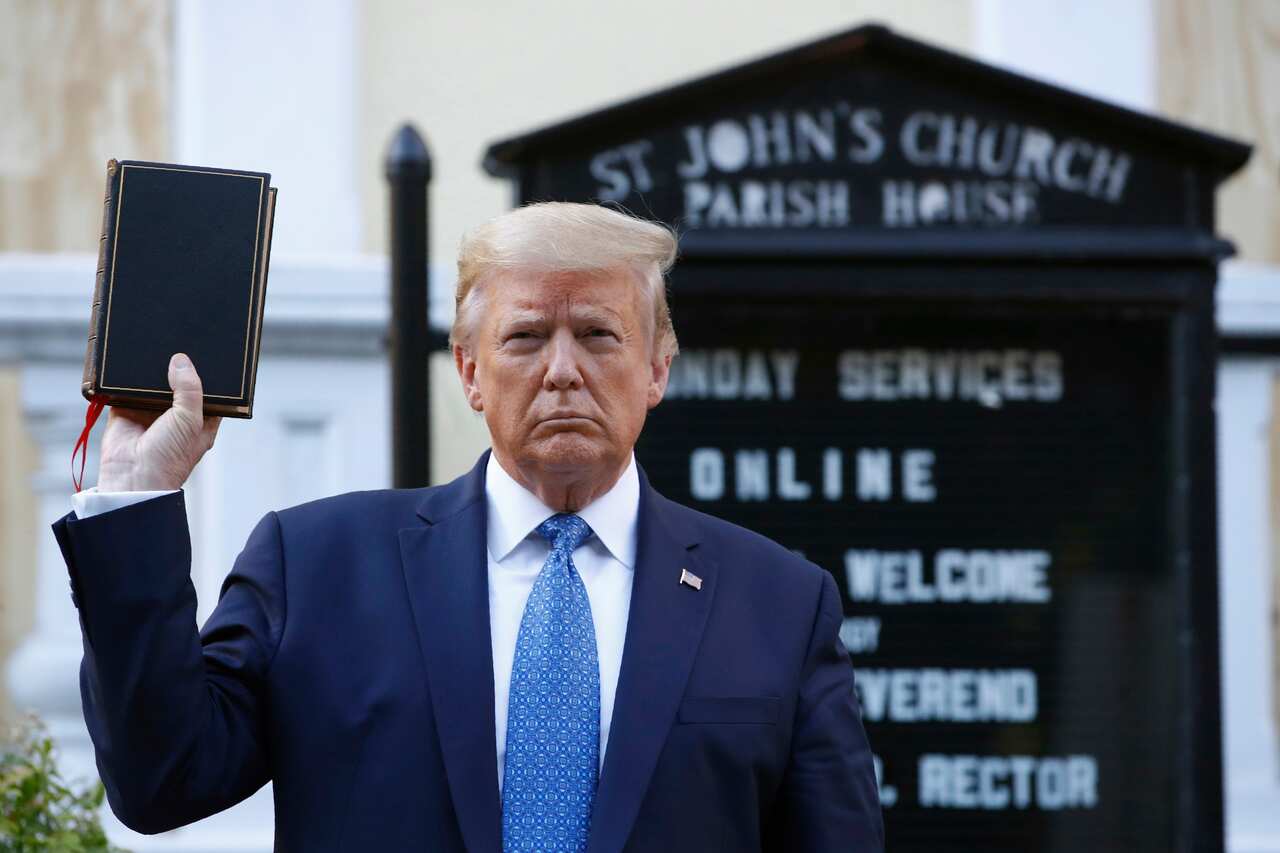 President Donald Trump holds a Bible as he visits outside St. John's Church across Lafayette Park from the White House on June 1.