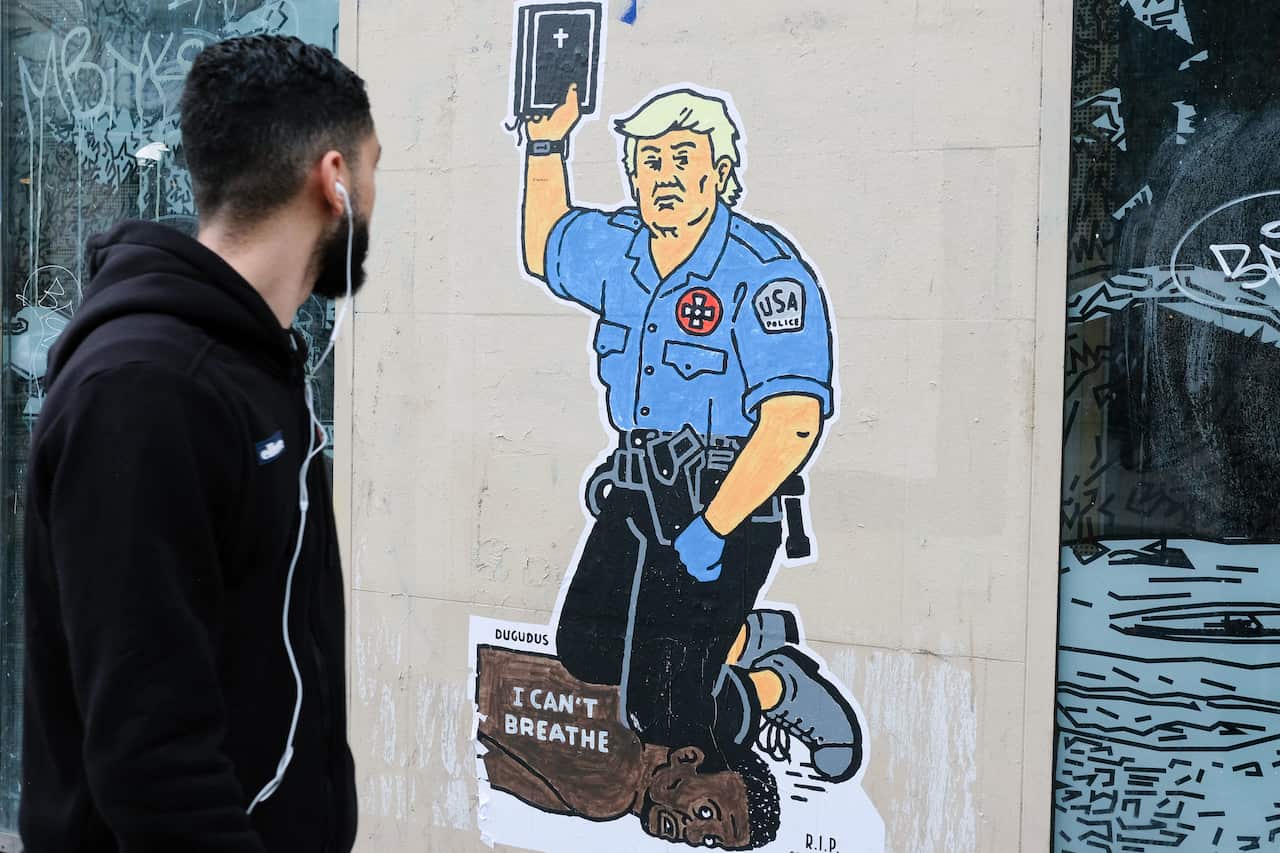 A graffiti by artist Dugudus about George Floyd's death is seen in Paris.