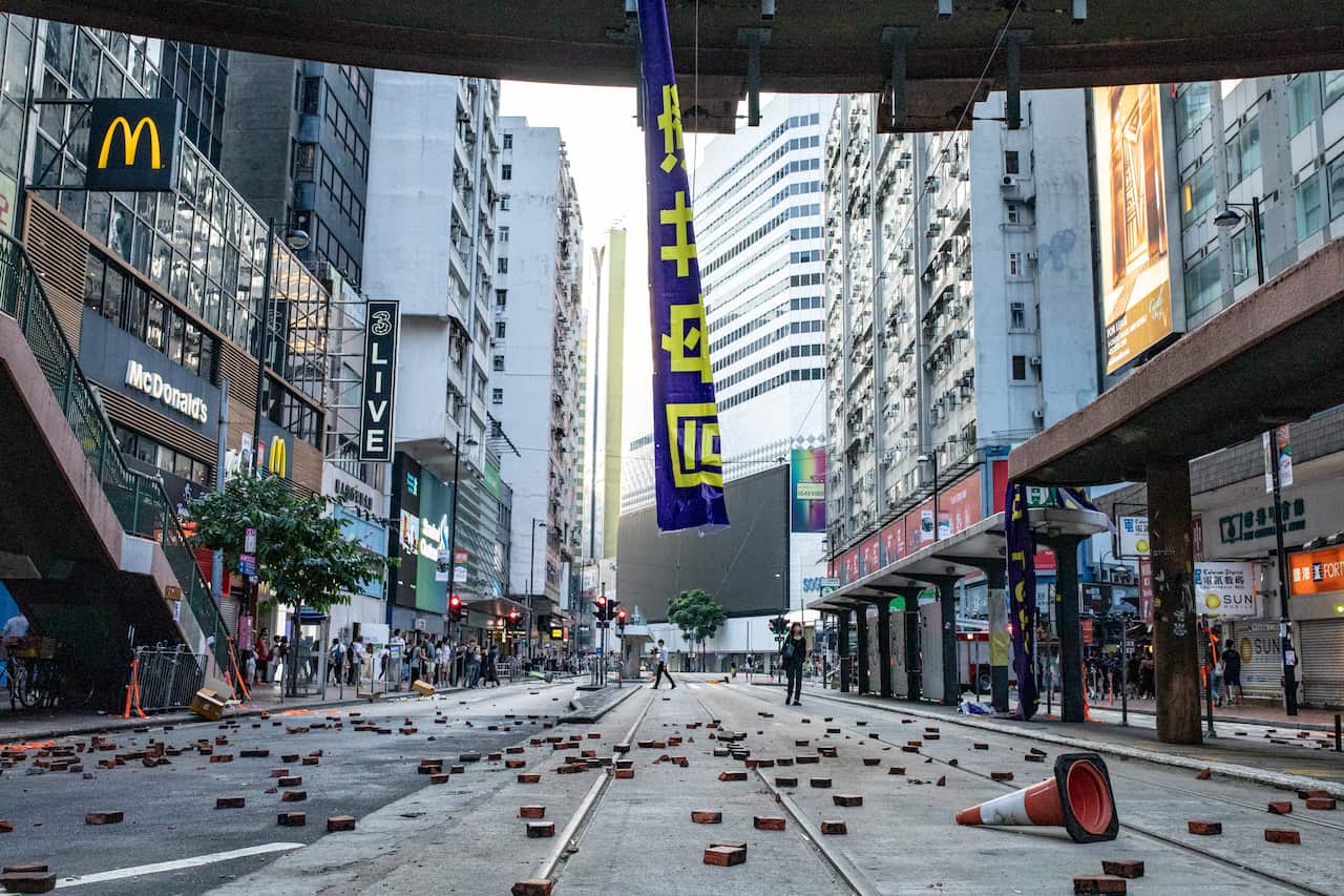 The street at causeway Bay filled with bricks and traffic corns as barricades during an anti-government demonstration.
