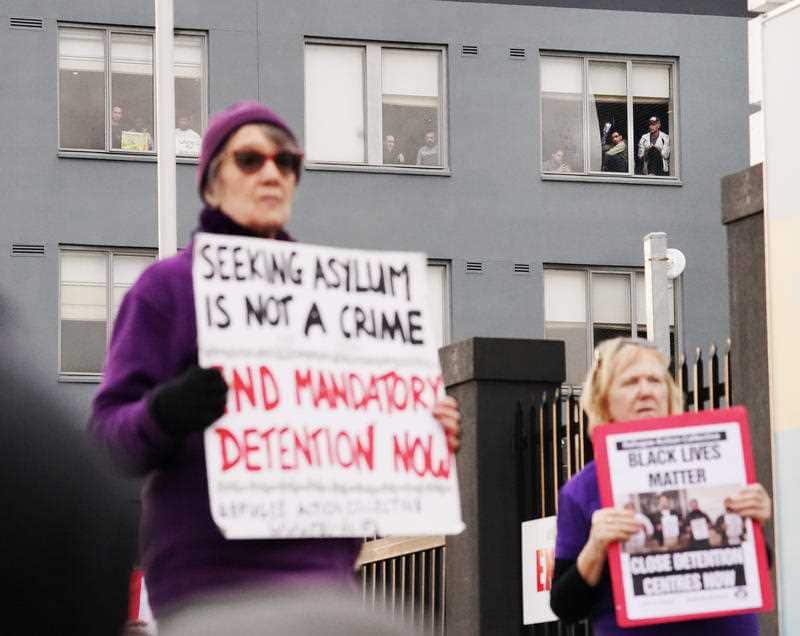 Refugees and protesters participate in a "Free The Refugees" rally at the Mantra Hotel in Melbourne, Saturday, June 13, 2020.