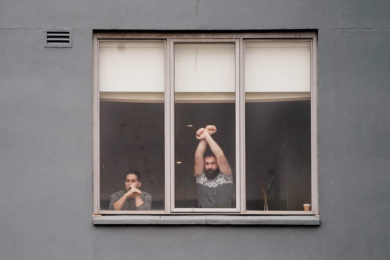Refugees participate detained in the Mantra Hotel in Melbourne.