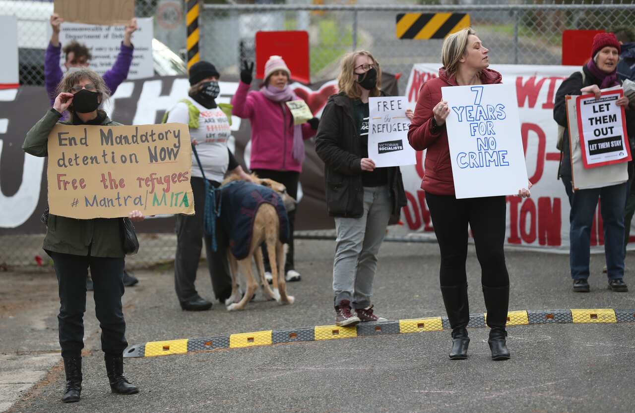 Protesters participate in a "Free The Refugees" rally at the Melbourne Immigration Transit Accommodation Centre in Melbourne.