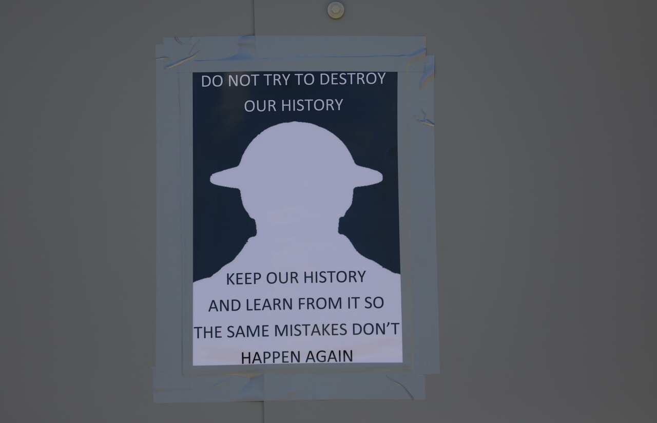 A sign advising against the destruction of statues is pictured by the Winston Churchill statue ahead of a Black lives matter demonstration in London.