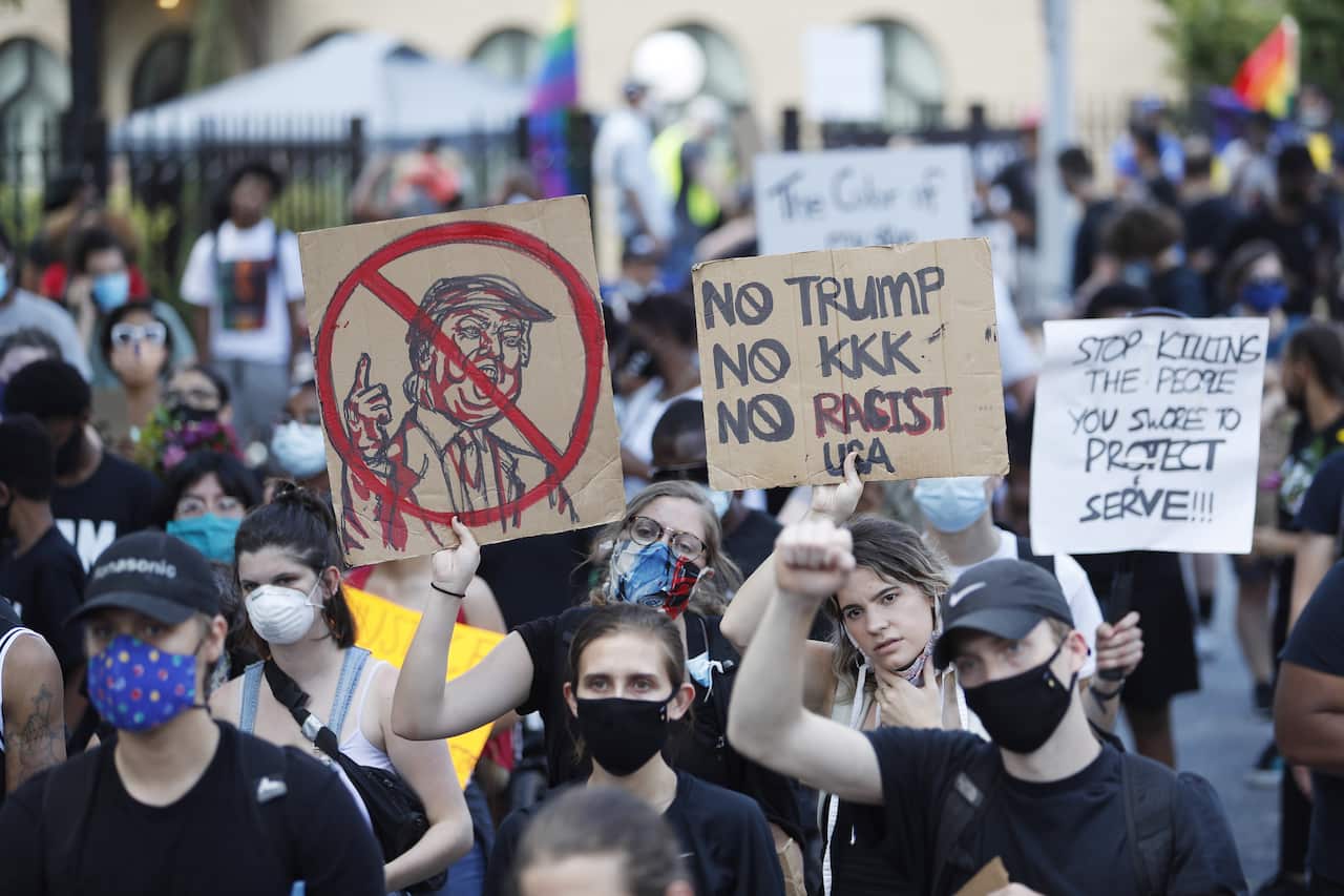 Protesters march near the Georgia Capitol after police shot and killed Rayshard Brooks.