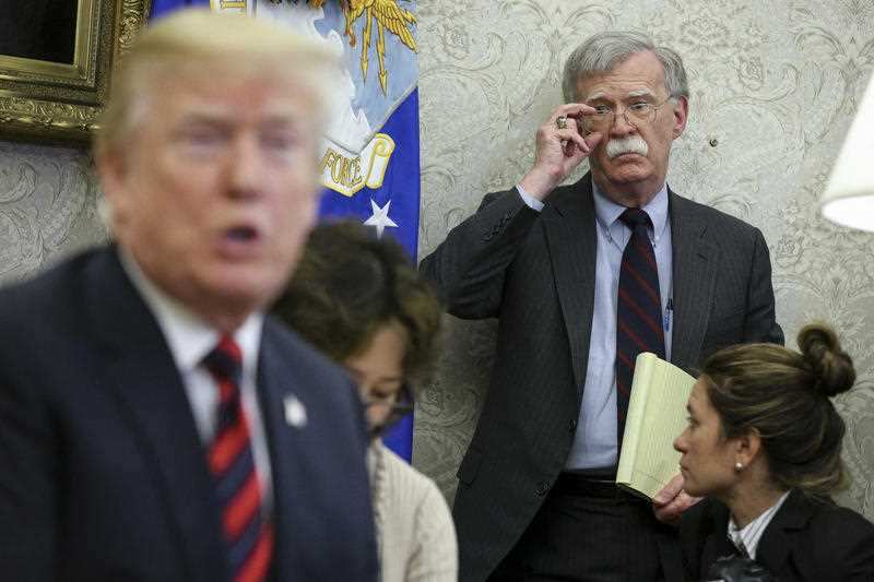 File photo dated May 22, 2018 of Donald Trump speaking as John Bolton listens