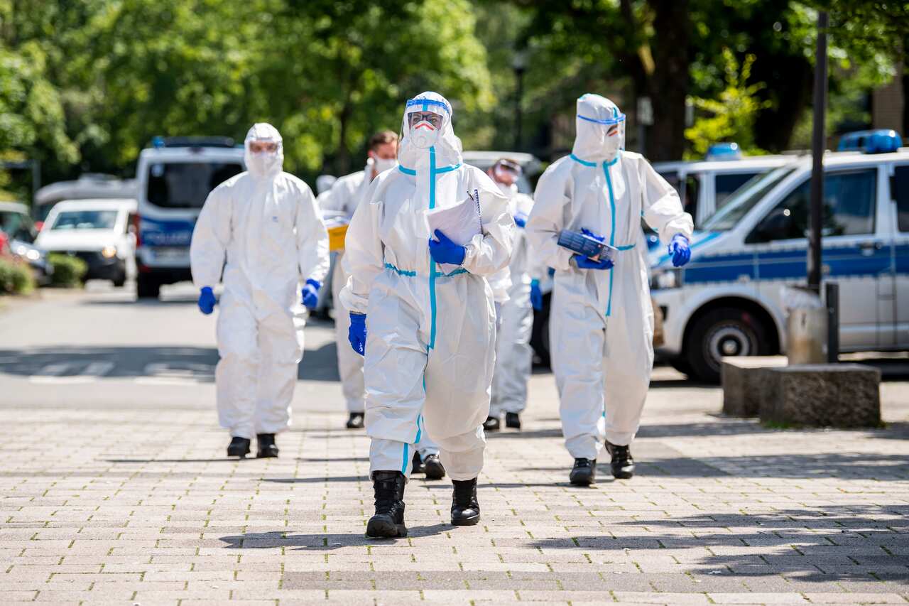 German army soldiers in protective suits arriveto test more people for the coronavirusin the city of Verl.