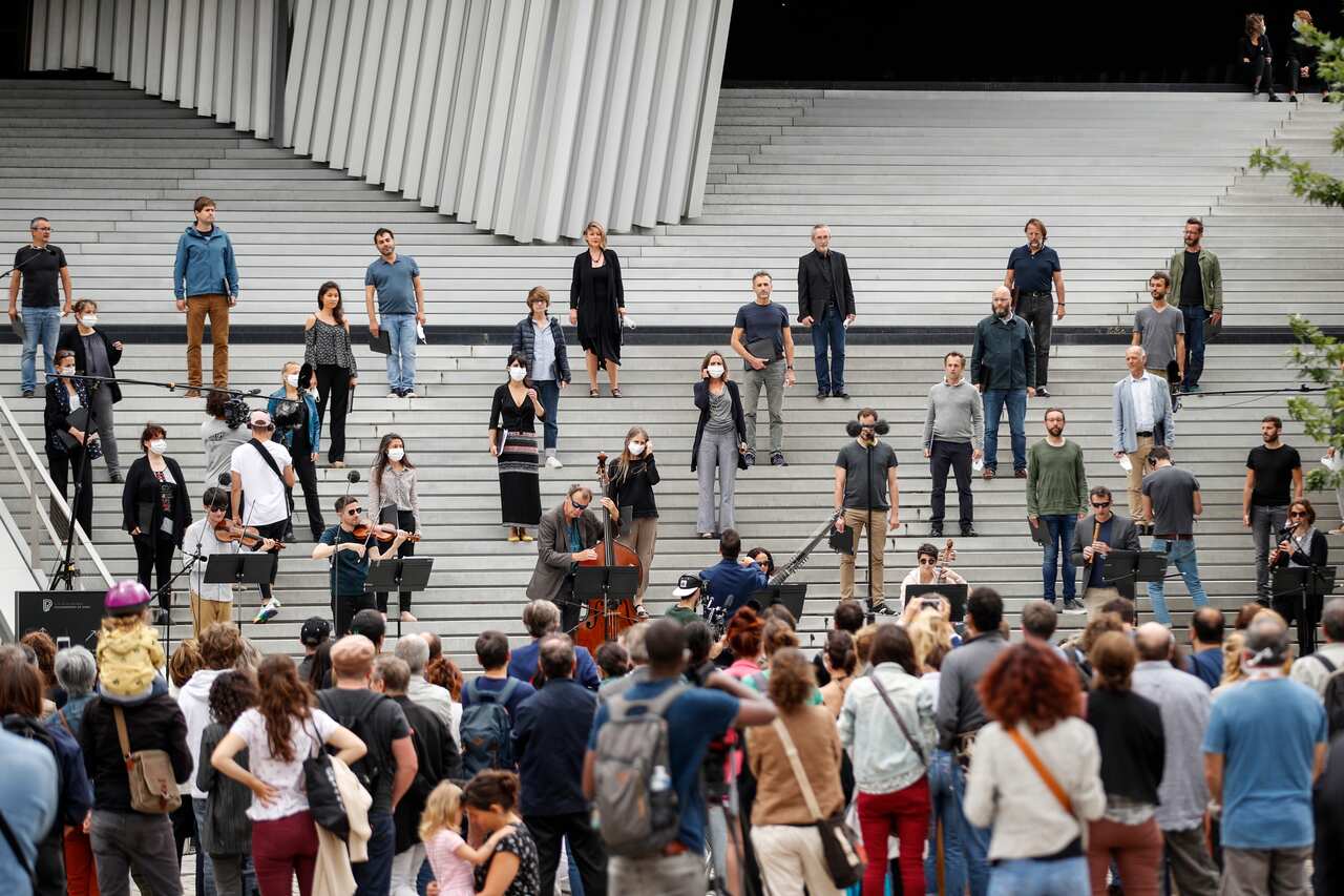 A classic orchestra performs live outside the Philharmonie in Paris as part of France's annual music festival.