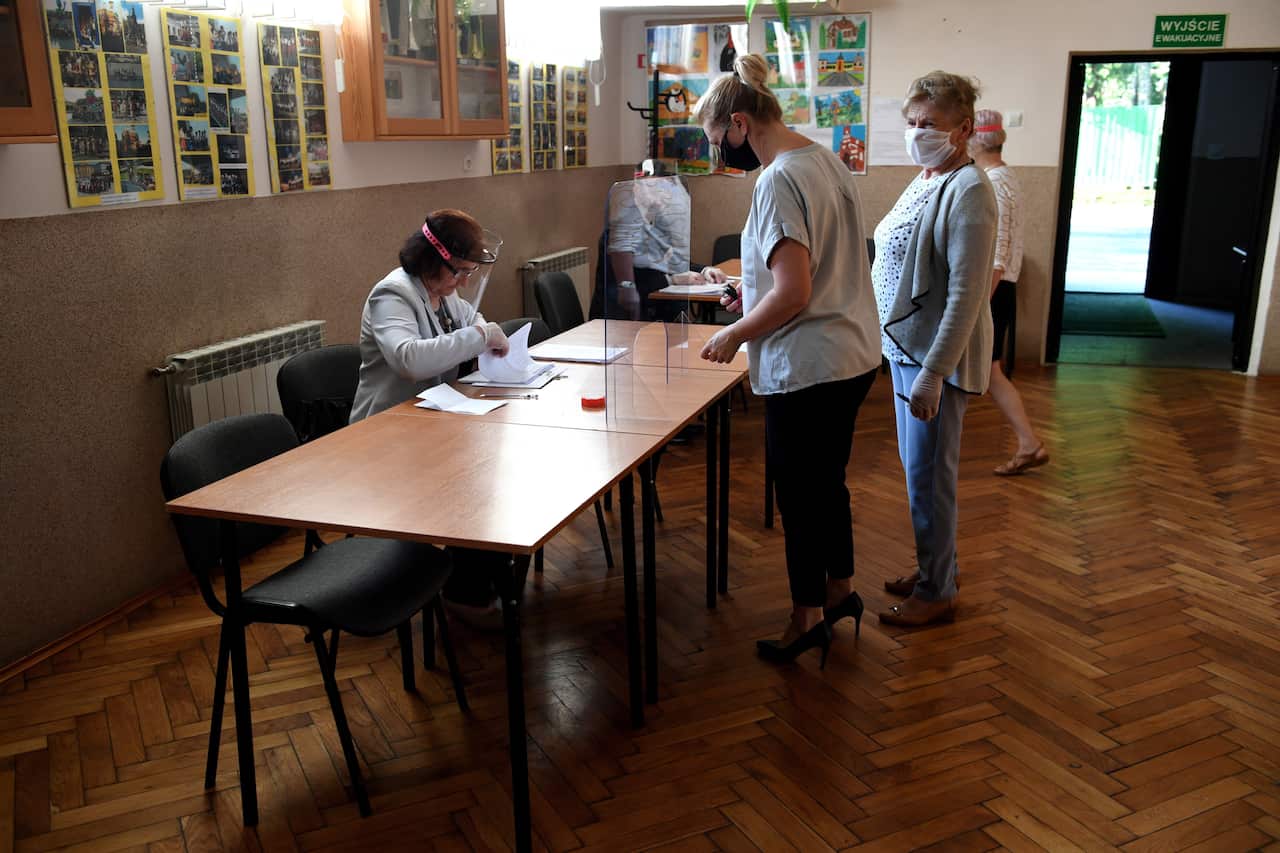 People vote during the presidential election at a polling station in Krasiczyn, Poland.