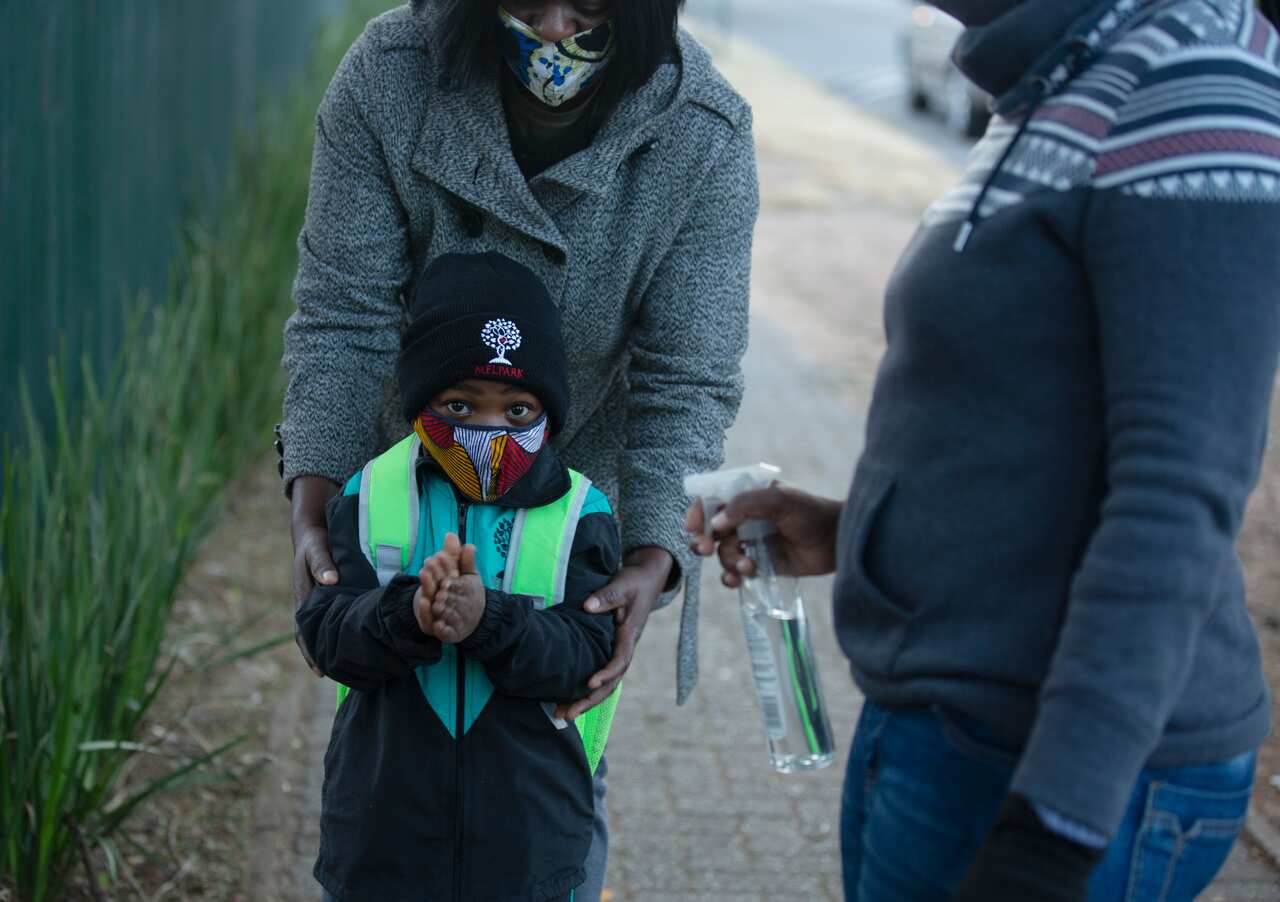 A pupil has his hands sanitised, as students returned to the classroom this month.