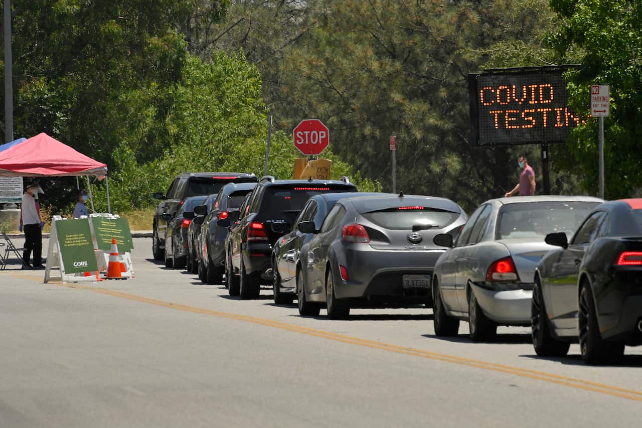 Cars line up for coronavirus testing at Hansen Dam Recreation Center, Tuesday, July 7, 2020, in Los Angeles. (AP Photo/Mark J. Terrill)