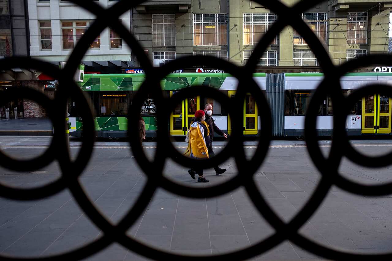 People wearing face masks are seen during a lockdown in Melbourne. 