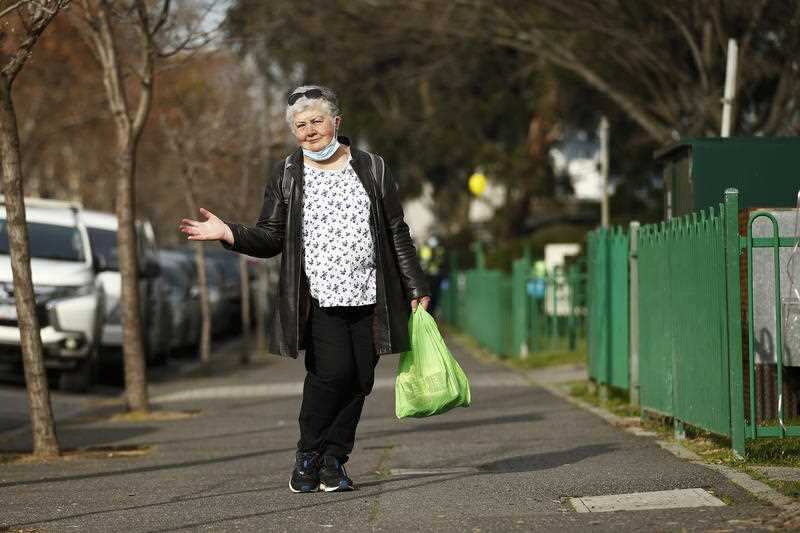 A resident of a public housing tower in North Melbourne is seen out and about after having restrictions eased, in Melbourne, Friday, July 10
