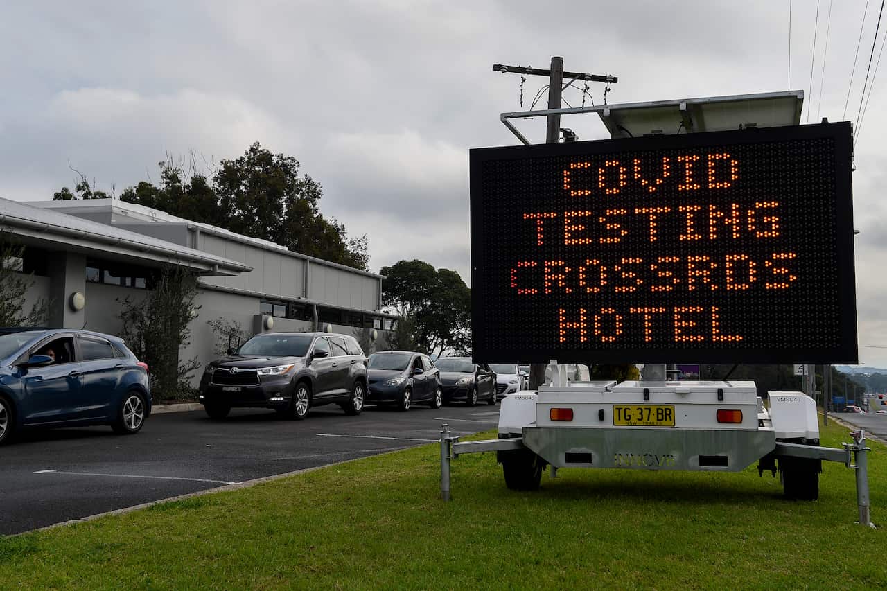 A COVID-19 testing alert sign at the Crossroads Hotel testing centre in Sydney.
