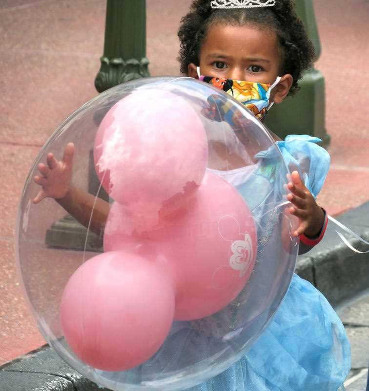 A young girl at the re-opening of Disney World, Florida