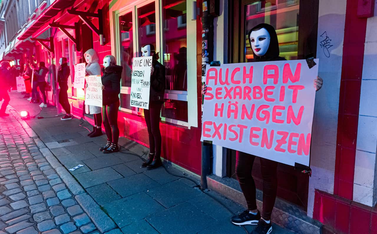 Prostitutes take part in a demonstration to demand the opening of brothels in Saint Pauli red-light district in Hamburg, Germany.
