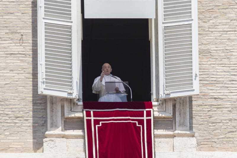 Pope Francis at the window of his studio overlooking St. Peter's Square 