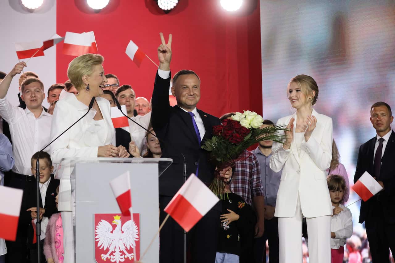 Incumbent President Andrzej Duda with his wife Agata Kornhauser-Duda and daughter Kinga Duda react after initial exit polls in Polish Presidential elections.