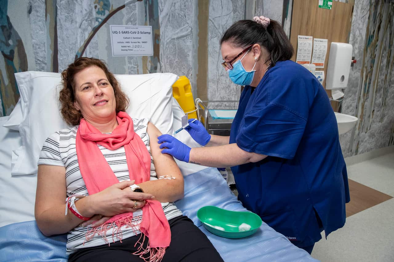A volunteer is seen during a coronavirus vaccine development announcement in Brisbane, Monday, July 13, 2020.
