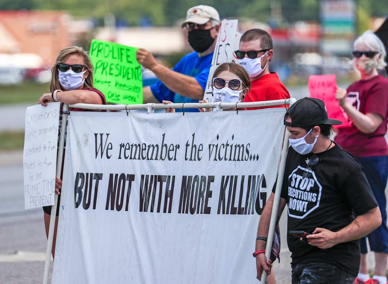 People gather to protest the resumption of federal executions near the US Penitentiary and execution chamber in Terre Haute, Indiana, in July 2020.