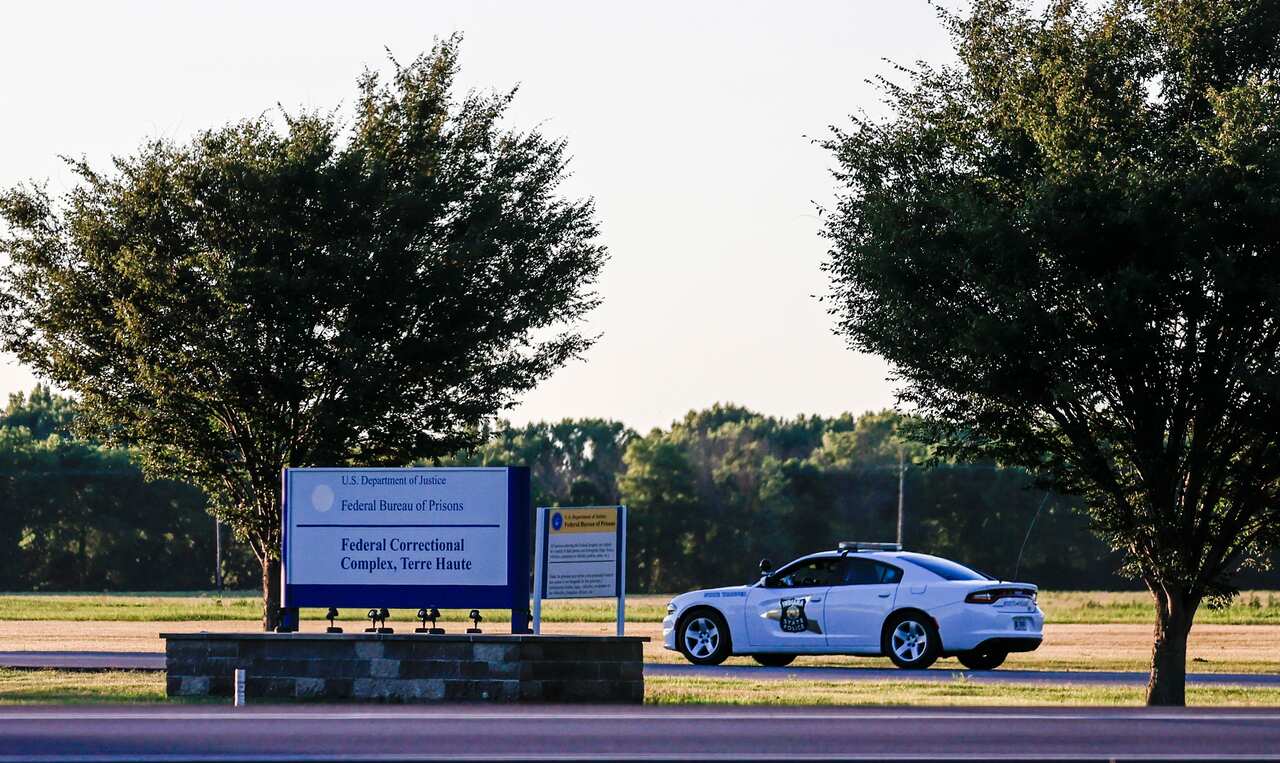 An Indiana State Police car drives onto the US Penitentiary complex that houses the federal execution chamber in Terre Haute, Indiana, USA, 13 July 2020