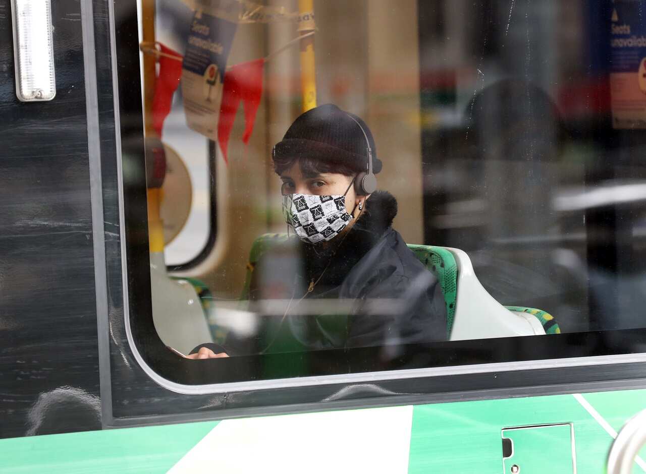 A tram passenger wearing a mask in Melbourne.