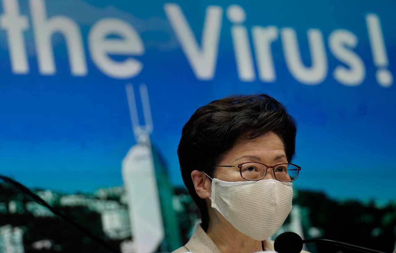 Hong Kong leader Carrie Lam introduced renewed anti-virus measures Sunday, saying she sees no sign that the spike in cases is under control. 