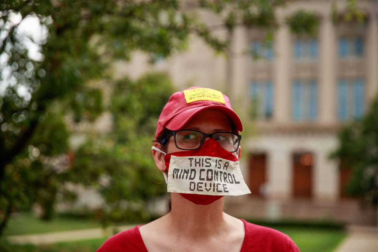 A woman makes a statement during the We Will Not Comply anti-mask rally in Indianapolis, US.