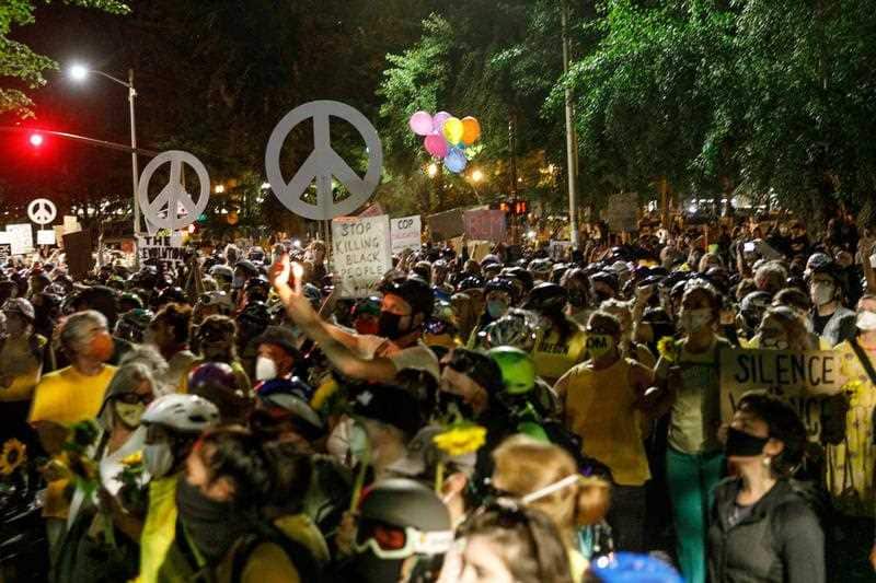 Hundreds of protesters, including a “Moms March”, demonstrate against Federal intervention, police brutality, and racial inequalities in Portland, Oregon.