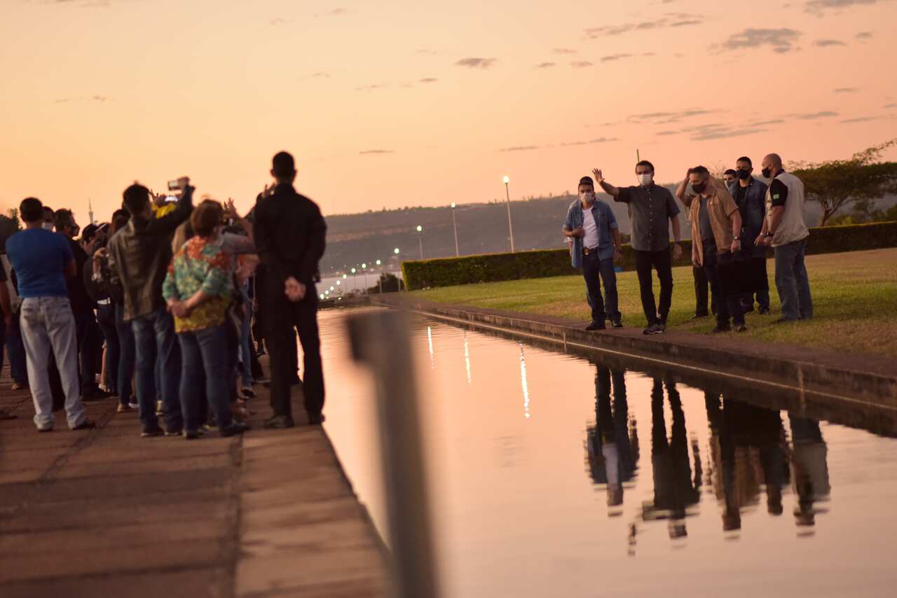 Followers of the far-right politician gathered again around the presidential residence to express support amidst his COVID-19 case. 