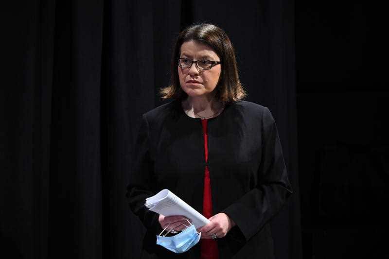 Health Minister Jenny Mikakos looks on as Premier Daniel Andrews addresses the media during a press conference on Thursday
