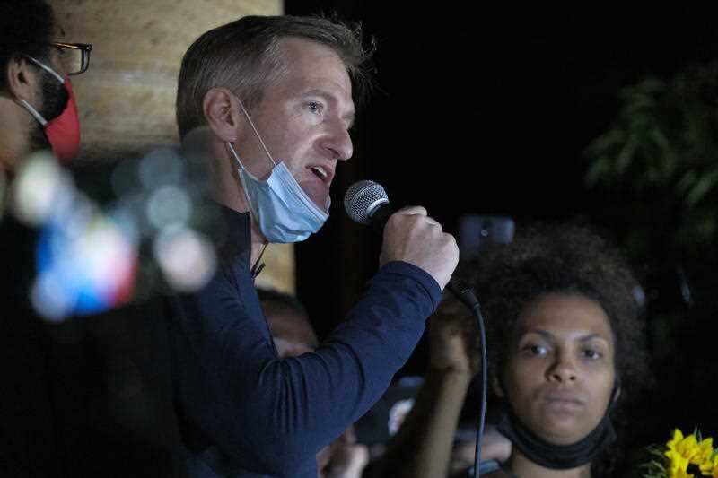 Mayor Ted Wheeler in front of a massive crowd outside the Justice Center in Portland