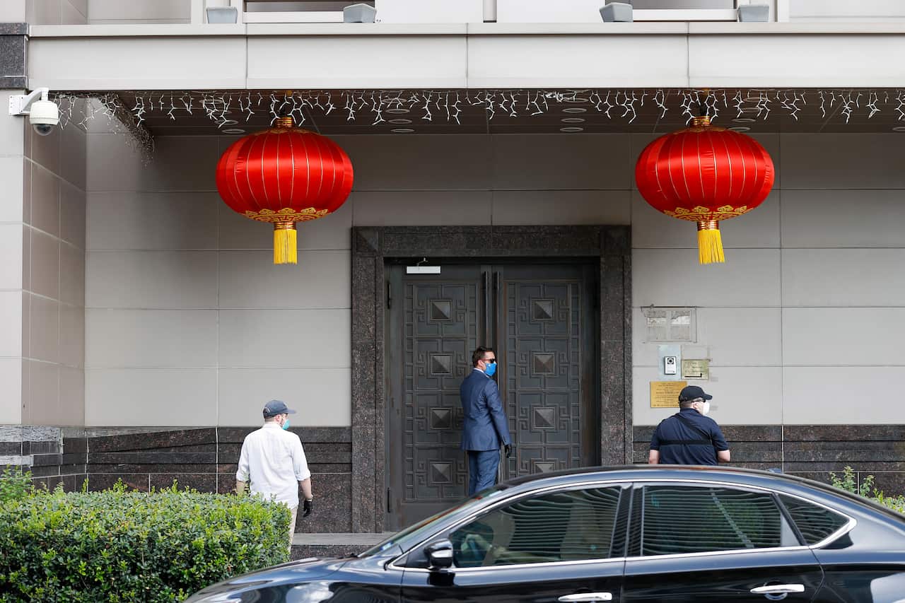 Officials try to gain access to the China Consulate General building in Houston, Texas.