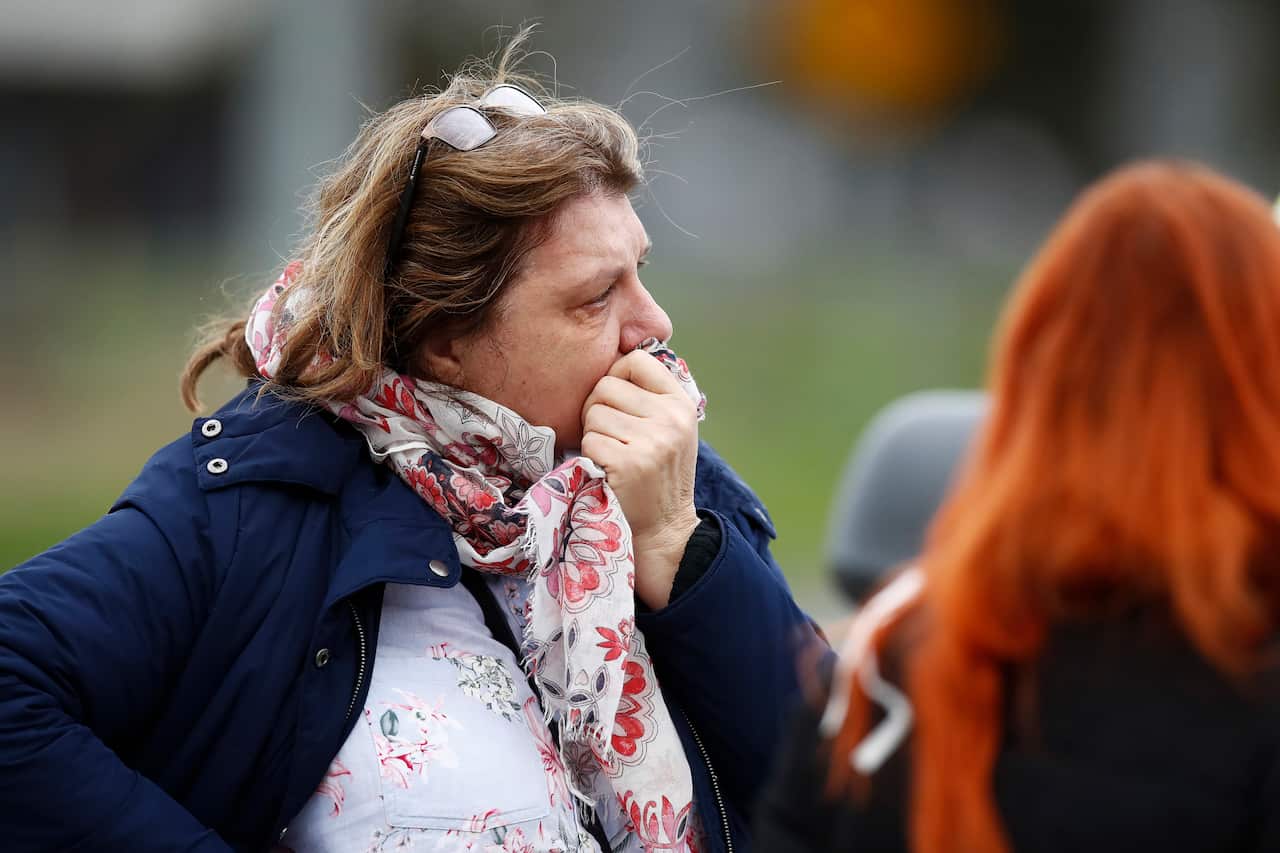 Family members of residents are seen outside Epping Gardens Aged Care Facility in Epping, Melbourne, Tuesday, 28 July, 2020.