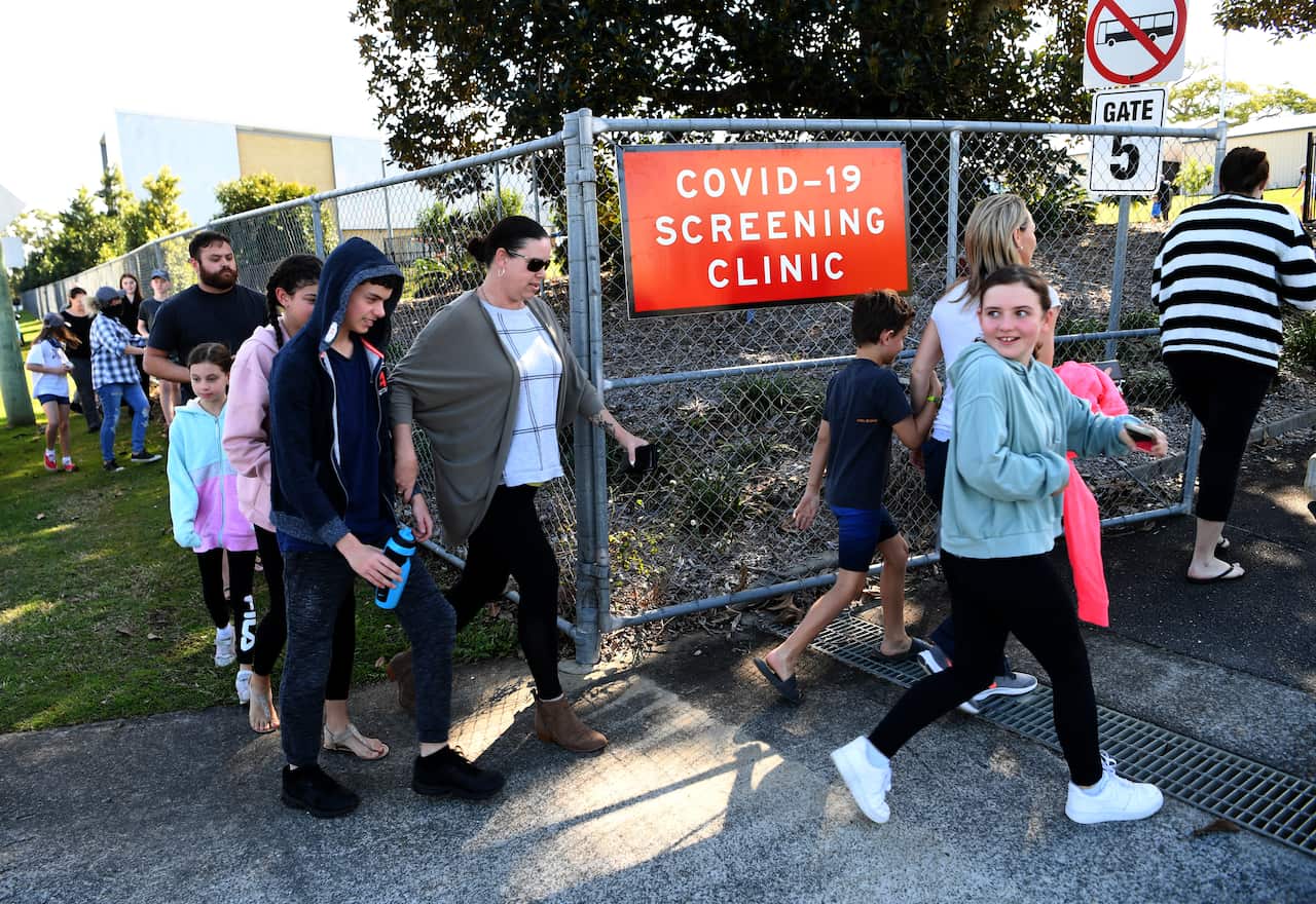 People arrive to get COVID-19 tested at the Parklands Christian College in Logan, south of Brisbane, Wednesday, July 29, 2020. The school has been temporarily closed after an employee tested positive for COVID-19. (AAP Image/Dan Peled) NO ARCHIVING