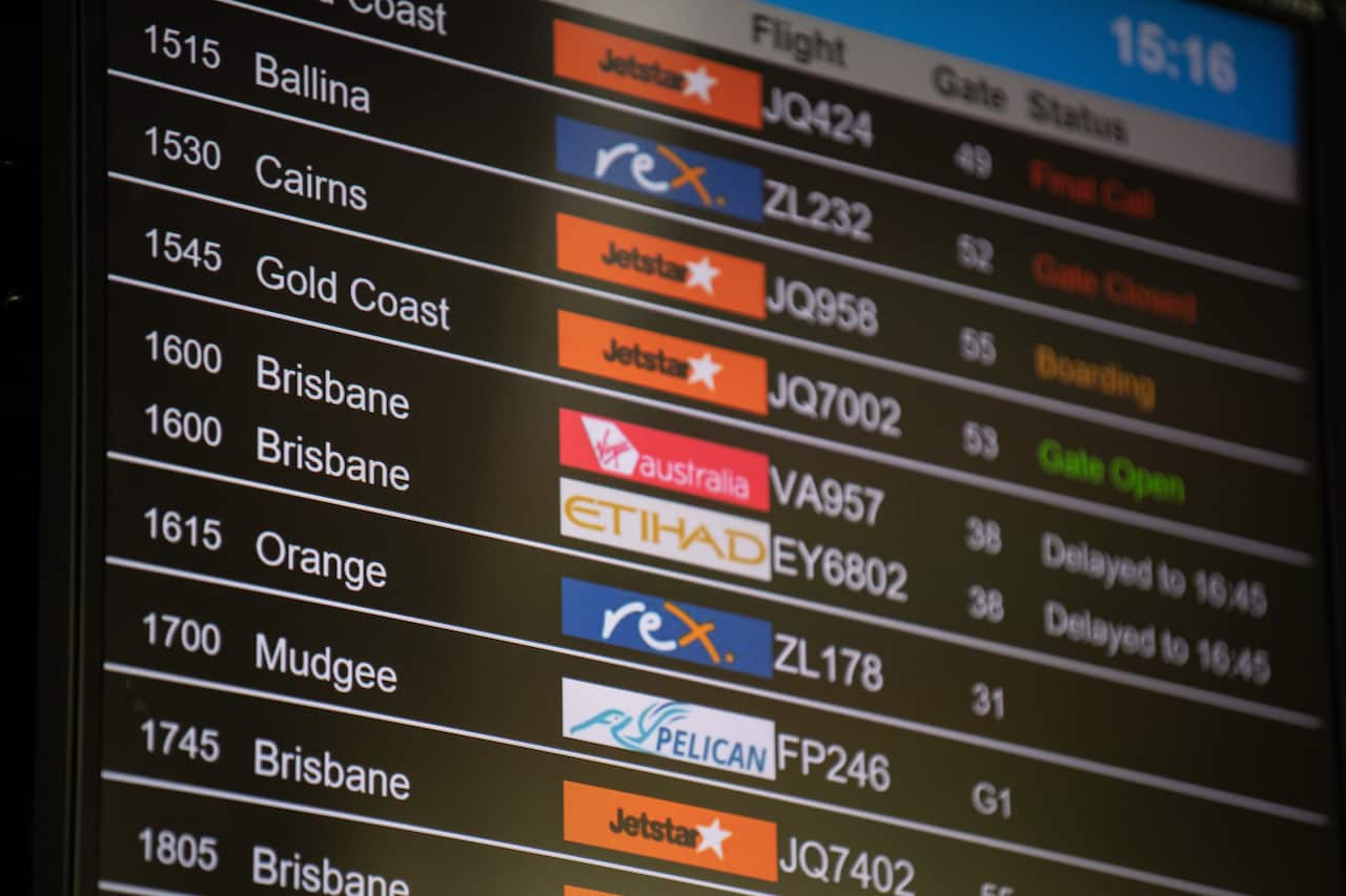 Information boards displaying flights to Queensland at Sydney Domestic Airport, Sydney, Friday, July 31, 2020.