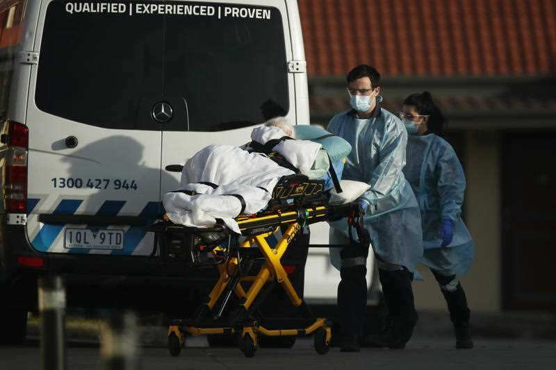 A resident is removed from St Basil’s Homes for the Aged in Fawkner, Melbourne, Friday, July 31, 2020