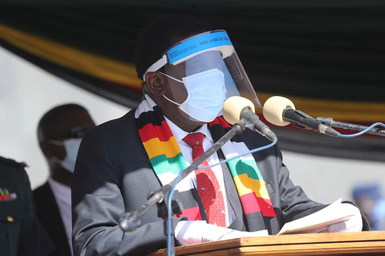 Zimbabwean President Emmerson Mnangagwa addresses mourners at the burial of  Zimbabwean minister Perence Shiri who died of  Covid-19/