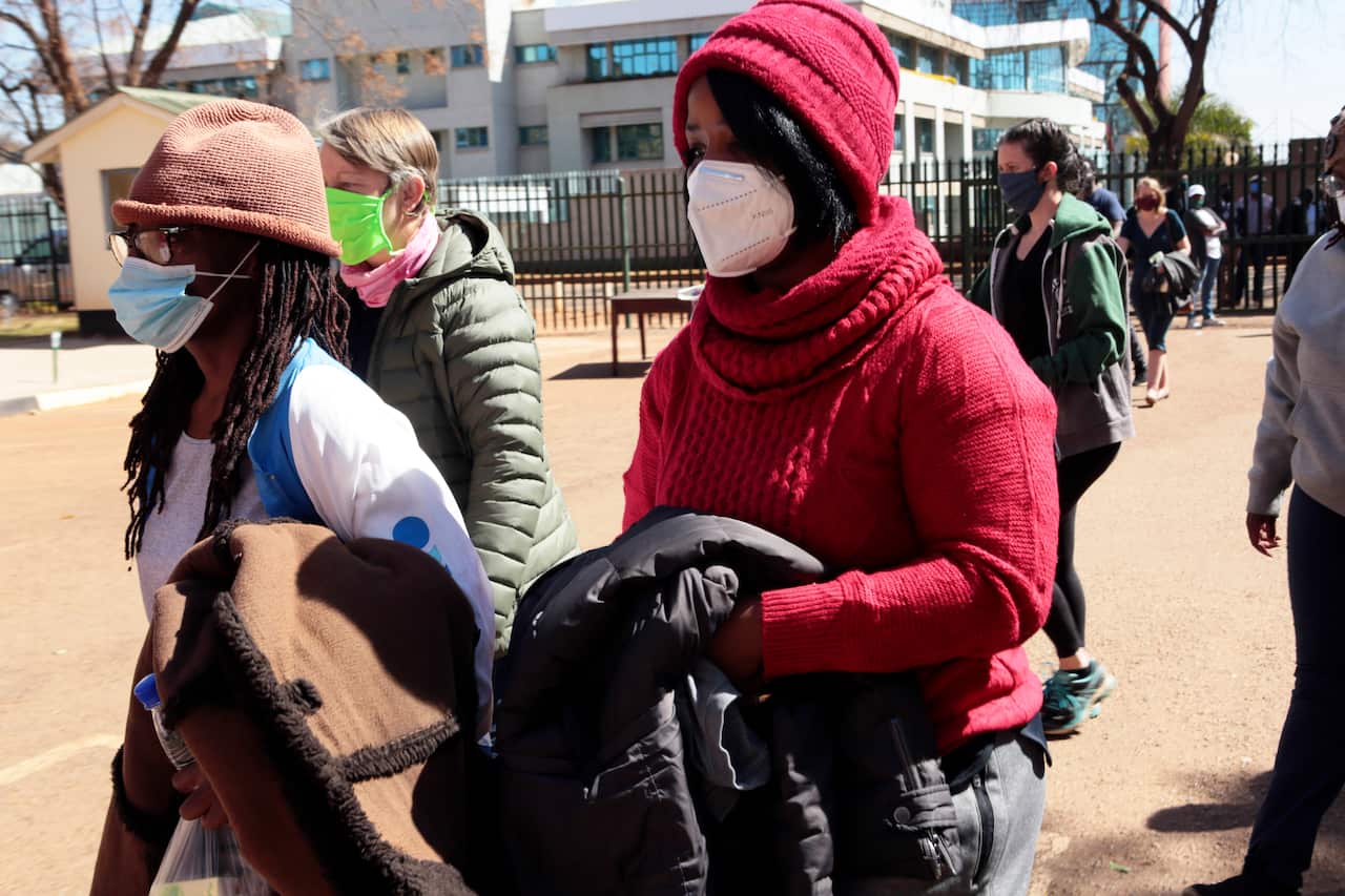 Tsitsi Dangerembga (left) prominent author and Fadzayi Mahere (right) spokeswoman for the main opposition party, appear at the magistrates courts in Harare,