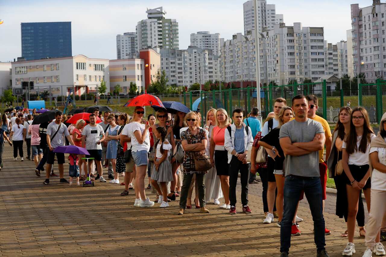 People queue to cast their votes in the Belarusian presidential election in Minsk, Belarus.
