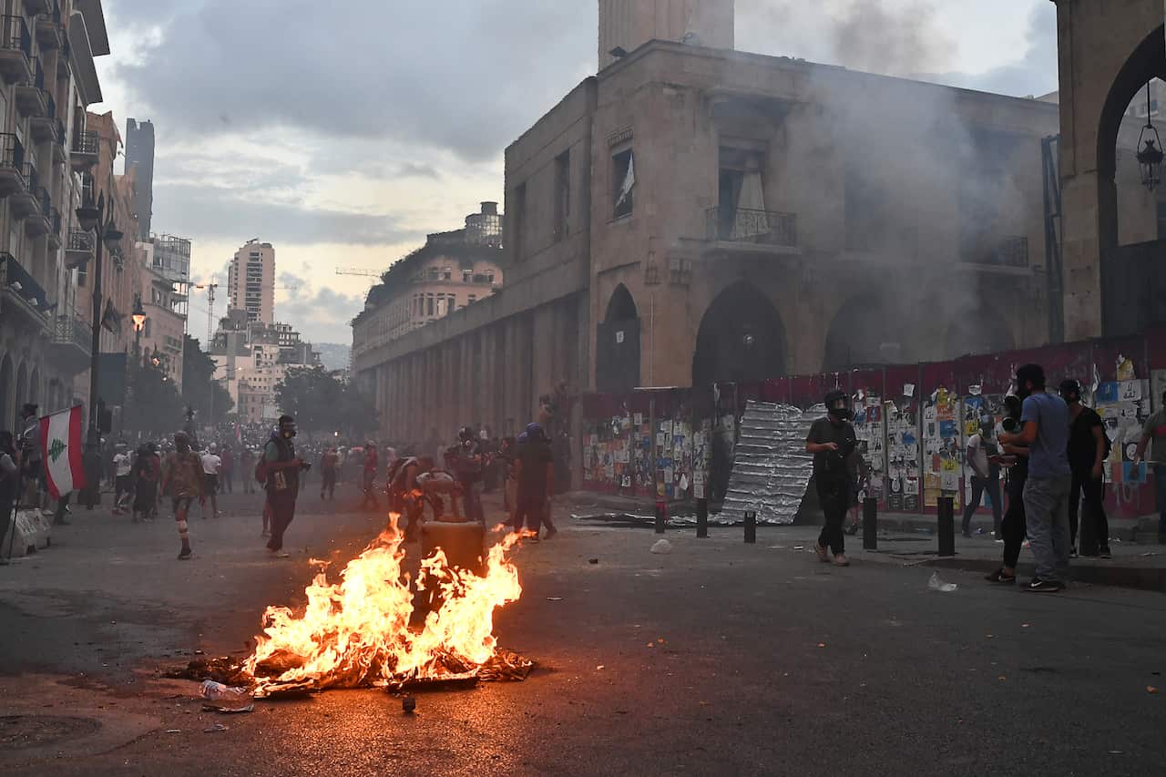 Outside the offices of Lebanon's Parliament, protesters demand the resignation of Lebanon's Prime Minister and his cabinet.