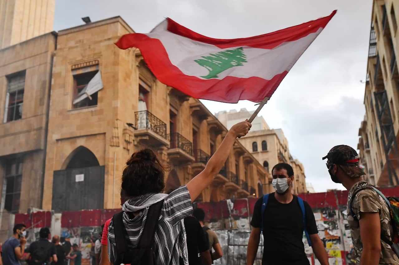 Protesters outside the offices of Lebanon's Parliament as Prime Minister Hassan Diab and his cabinet resigned on Monday.