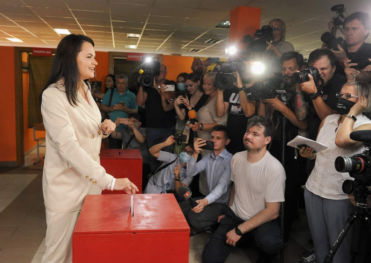 Presidential candidate of Belarus Svetlana Tikhanovskaya casts her ballot into the box at the polling station.