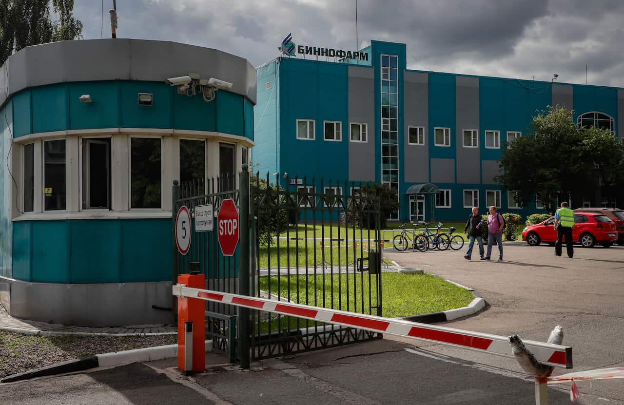 People walk in the Binnofarm factory, which is selected as the second manufacturer of Russia's new coronavirus vaccine.