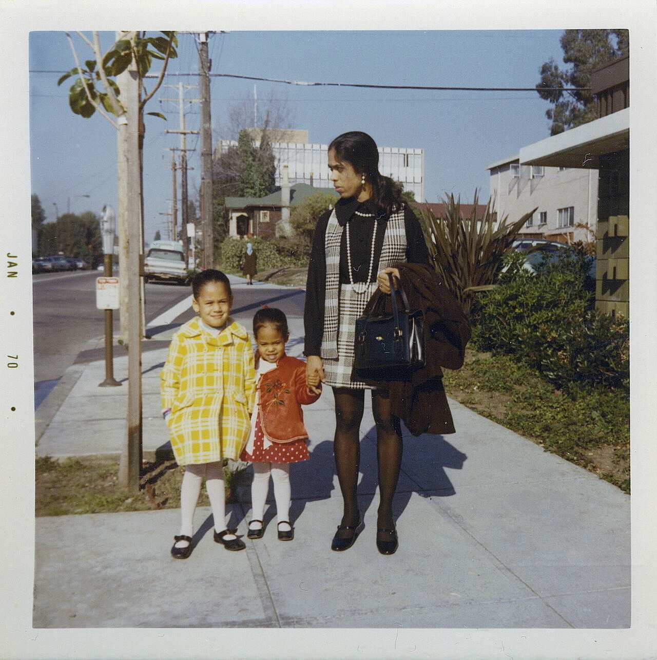 Ms Harris, left, with her sister, Maya, and mother, Shyamala, outside their apartment in Berkeley in 1970. 